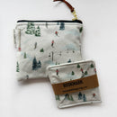 Small square pouch in white winter ski slopes