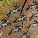 Iron-on patch | lucky rabbit's foot - 4.3" x 2.8": Patch attached to backer card