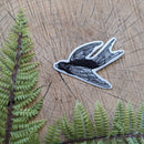 Iron-on patch | flying bird - black & white 3.5" x 2.5": Patch attached to backer card