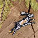 Iron-on patch | lucky rabbit's foot - 4.3" x 2.8": Patch attached to backer card
