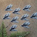 Iron-on patch | flying bird - black & white 3.5" x 2.5": Patch attached to backer card