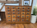 Antique Oak Apothecary Cabinet with 25 Drawers and Milk Glass Labels