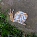 Iron-on patch | slow down snail - brown 1.6" x 2.6": Patch attached to backer card
