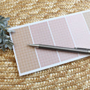 Boho, muted colors grid notepad with 7 sections: No plastic sleeve