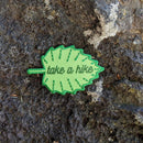 Iron-on patch | take a hike leaf - green 1.75" x 2.75": Patch attached to backer card